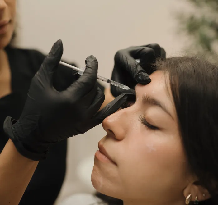 Close-up of a precise Botox injection at Oak Haus