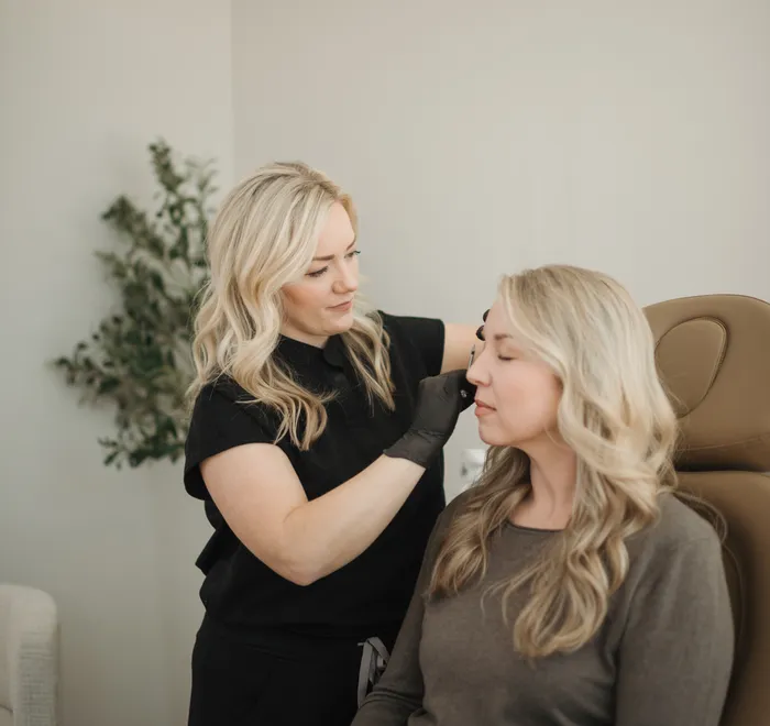 Jessica with a client during a Botox treatment at Oak Haus