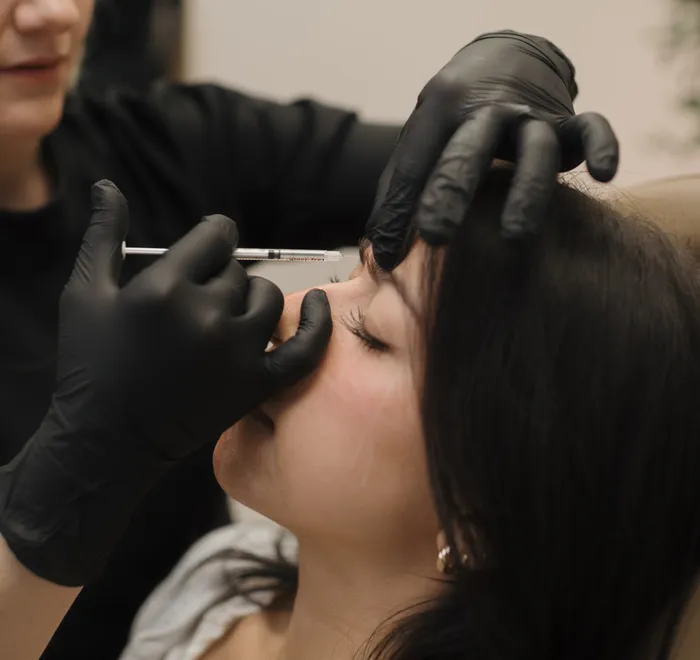 Jessica performing a Botox treatment at Oak Haus