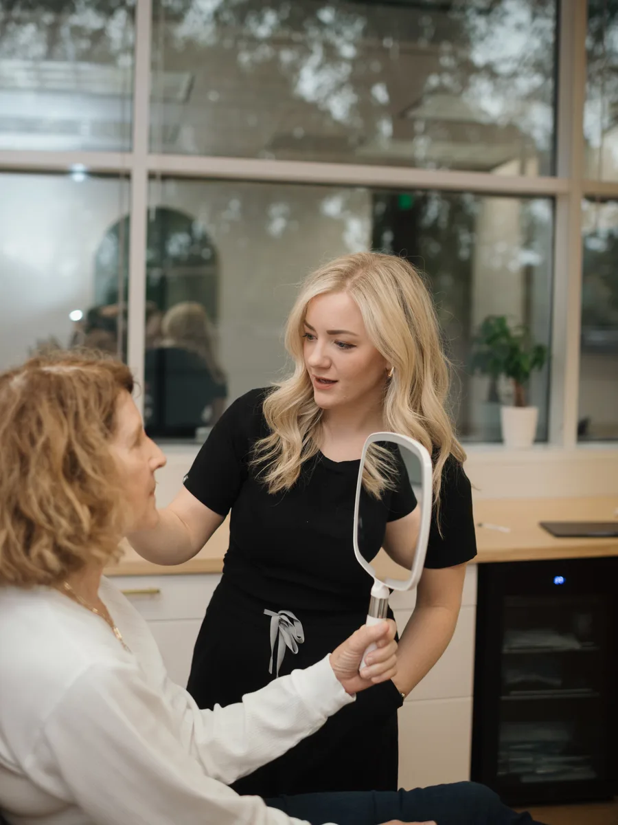 Oak Haus provider showing results to patient after treatment